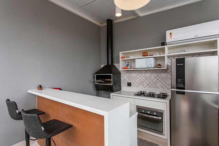 Wehome -Duplex: churrasqueira e vista da cidade.